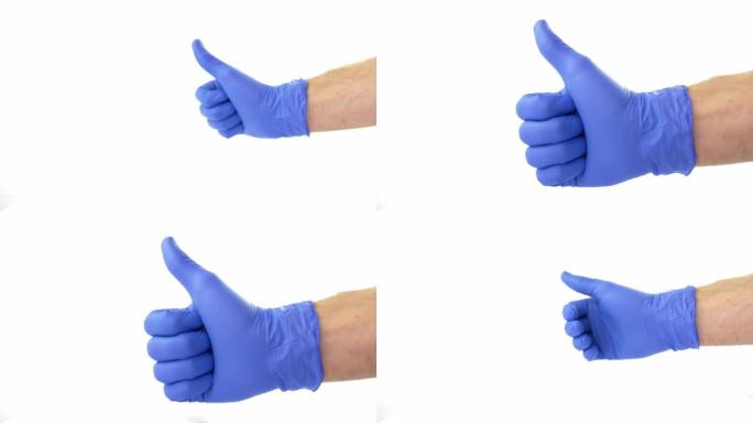 竖起大拇指信号显示在白色背景的蓝色防护手术手套中