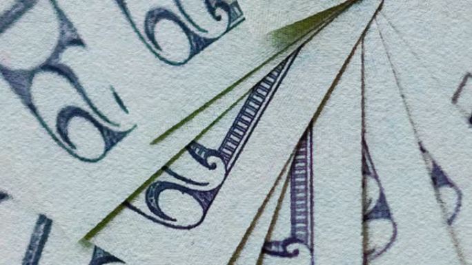 带有20美元钞票背景的水彩过滤高分辨率视频，代表了Covid- 19对美国经济的影响。