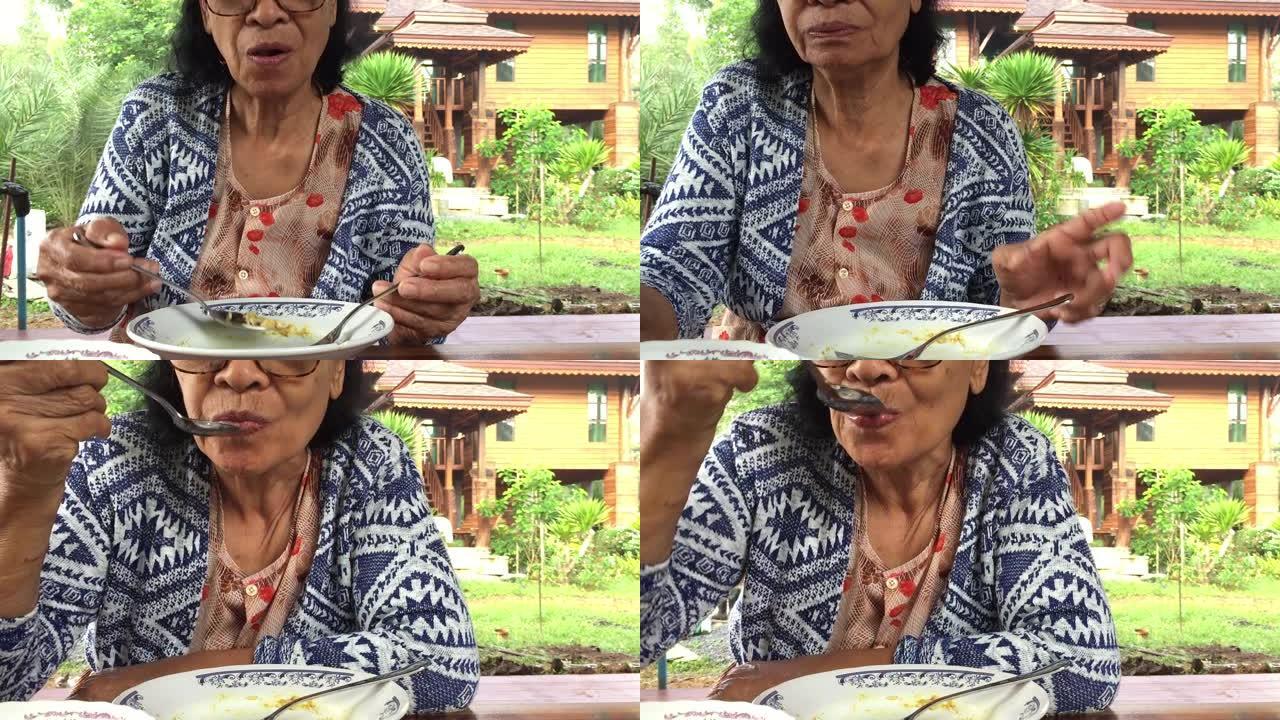 亚洲泰国老妇在家吃米饭