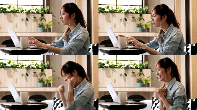 在共同工作空间中使用笔记本电脑的亚洲女性