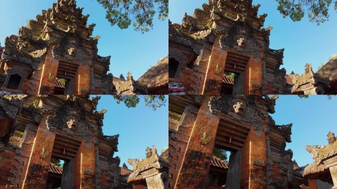 Steadicam拍摄了巴厘岛乌布村普里萨伦皇宫内的冬青门。前往印度尼西亚的概念