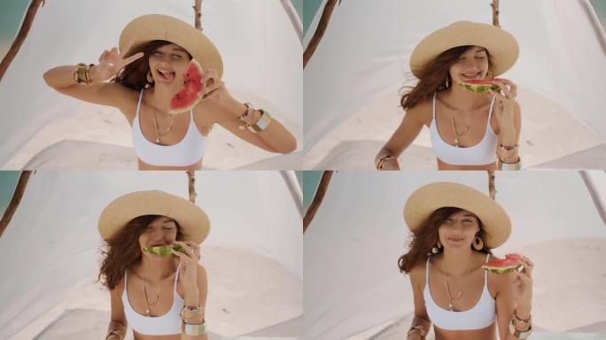 在热带海滩上吃西瓜的女人