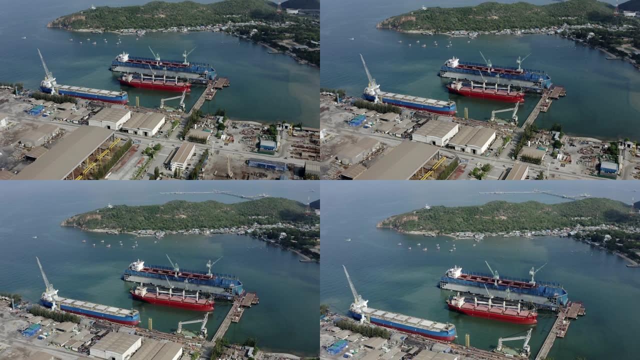 工业造船厂的空中景观货船。站在船坞无人机视图停车场的海船。