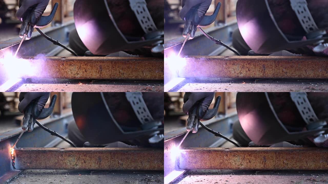 两个金属零件的焊接过程的特写。