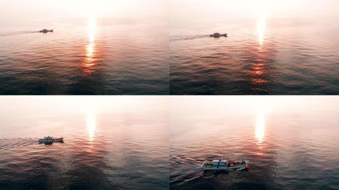 日落时间海上鱼船的鸟瞰图
