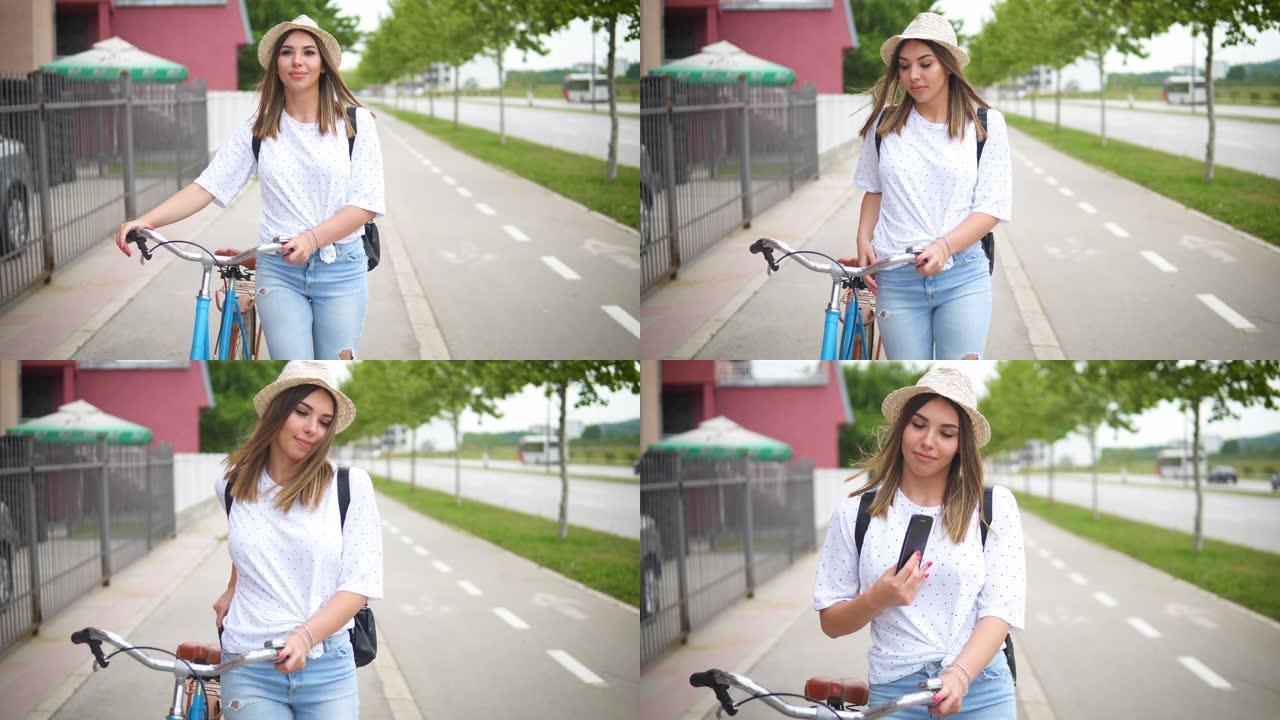 年轻漂亮的女人走路推着她的自行车。