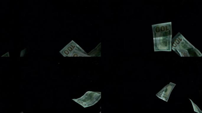 在4k可循环的黑色背景上掉落飞行的美国加拿大元钞票。4k的高质量下跌美元纸币。视频是可循环的