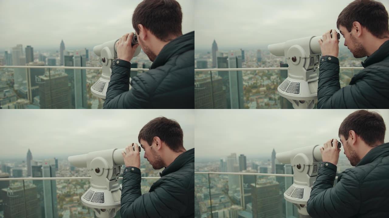 人类通过放大装置单眼在大城市的城市景观中观察
