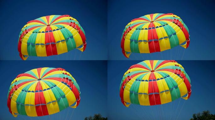 蓝天下精彩多彩的降落伞