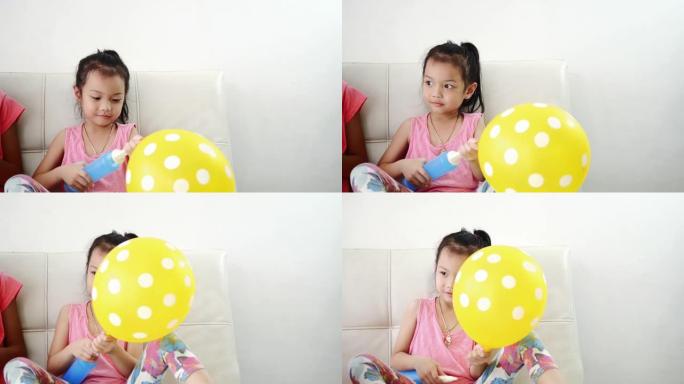 女孩在家抽气球。玩耍童年时光童趣