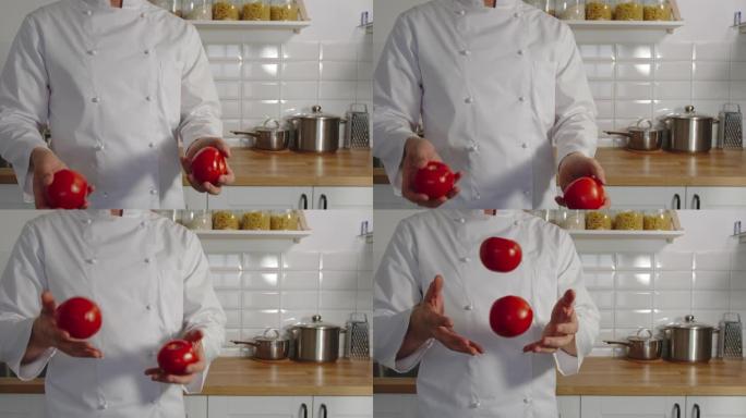 慢动作: 炊具在厨房里摆弄红色的西红柿