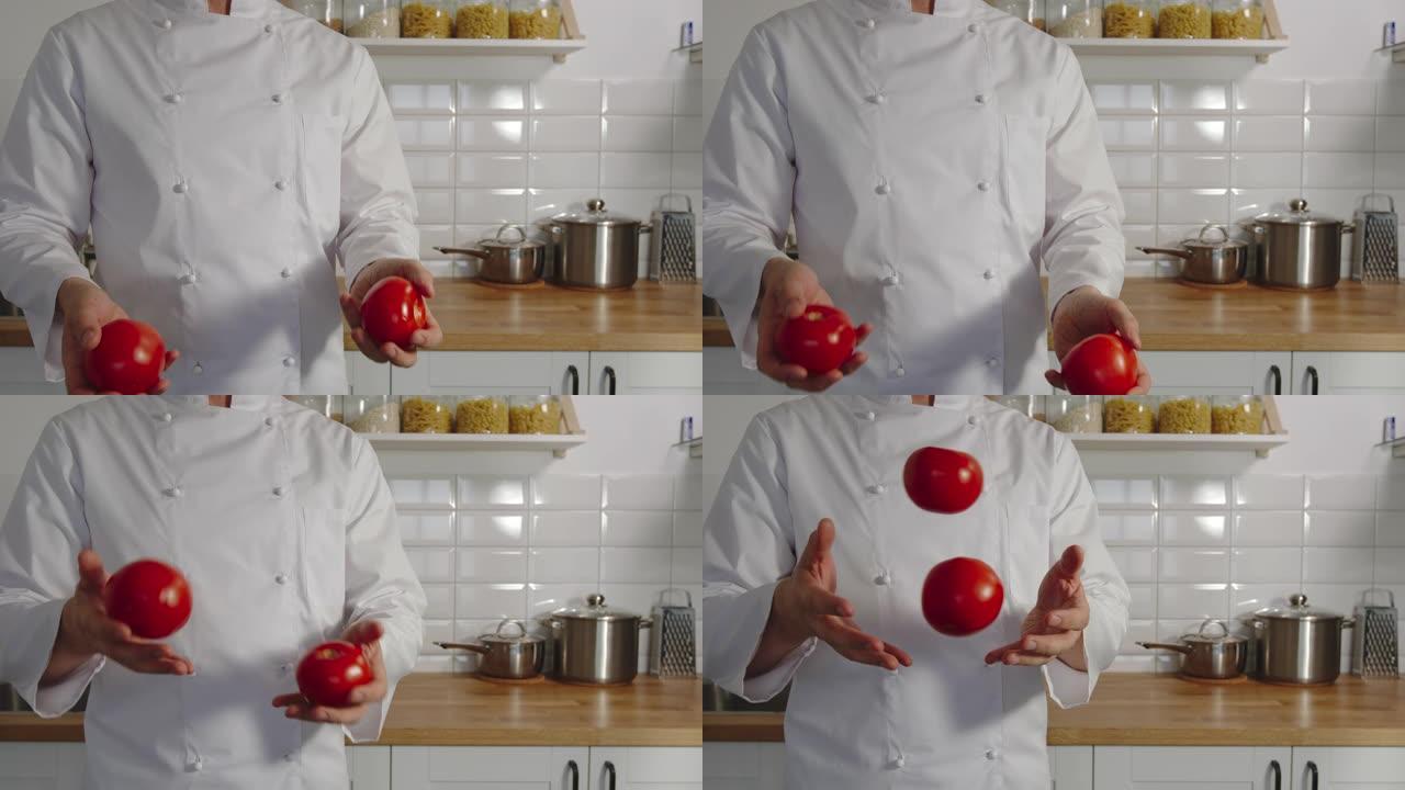 慢动作: 炊具在厨房里摆弄红色的西红柿