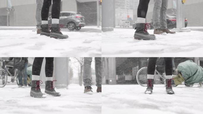 下雪时近距离拍摄两双脚