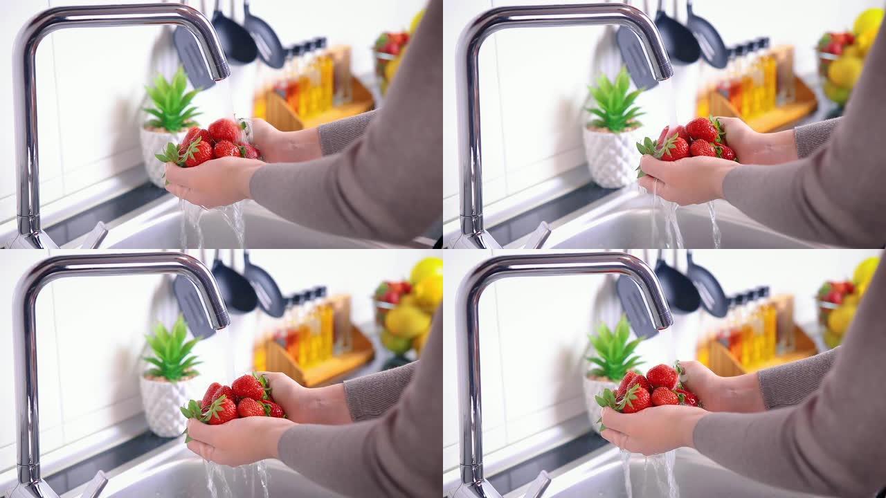 女人在厨房里洗草莓