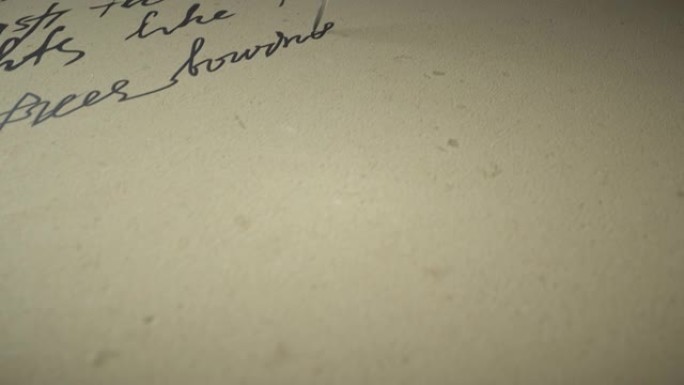 墨笔在旧纸上写诗