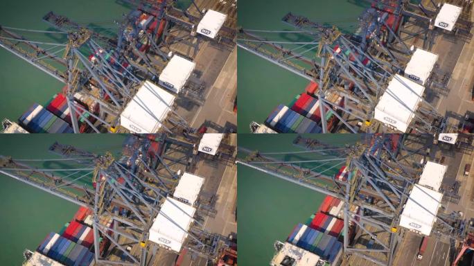 晴天香港城市港口集装箱码头起重机湾空中上下全景4k