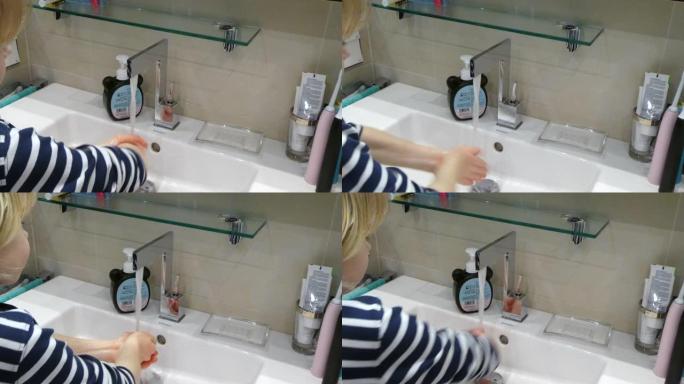 年轻可爱的男孩在家洗手。