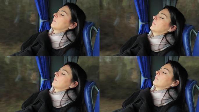 睡在公共汽车窗户旁边的正宗女孩。坦率的现实生活中的女性乘客在公路上旅行时在公共汽车上睡着了