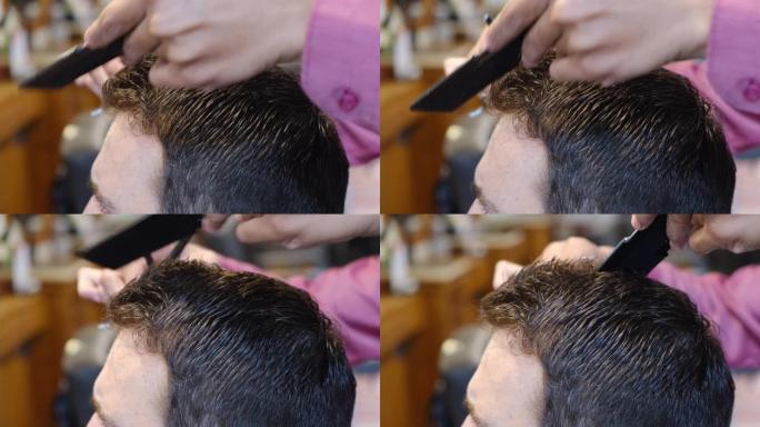 年轻人在理发店或发廊进行发型设计和理发。主人在理发店剪头发