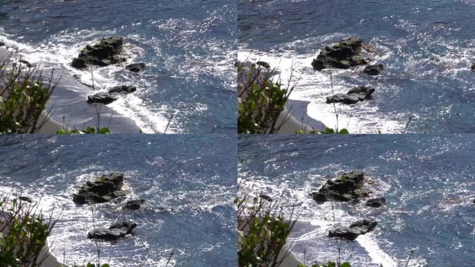 海浪撞击岩石和海滩