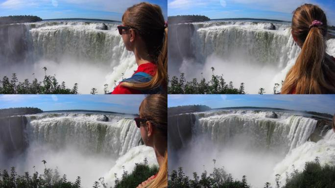 年轻女子从阿根廷一侧欣赏伊瓜苏瀑布的景色
