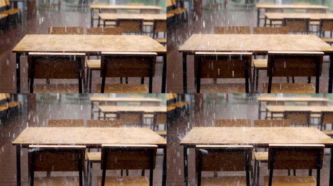 大雨在后院和潮湿的木桌上猛烈袭击