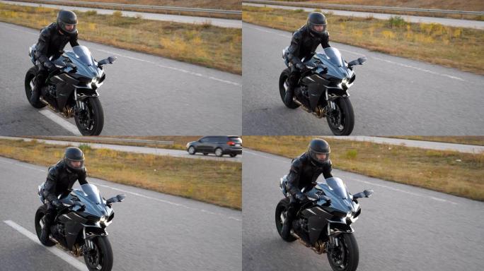 摩托车手在乡村公路上骑摩托车的俯视图。戴着头盔的年轻人在高速公路上快速骑现代运动摩托车。旅途中开车的