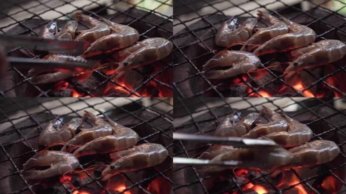 虾在传统的炉子上烧烤。美味的泰国海鲜菜单。泰国街头美食菜单。燃烧木炭，下面有热火焰。热门菜单，适合野