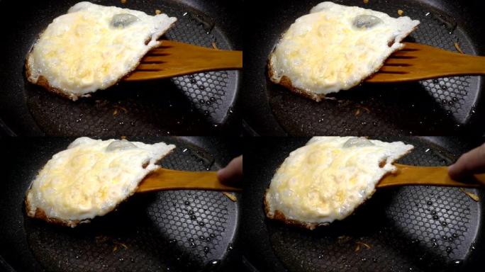 煎蛋用木铲慢动作。