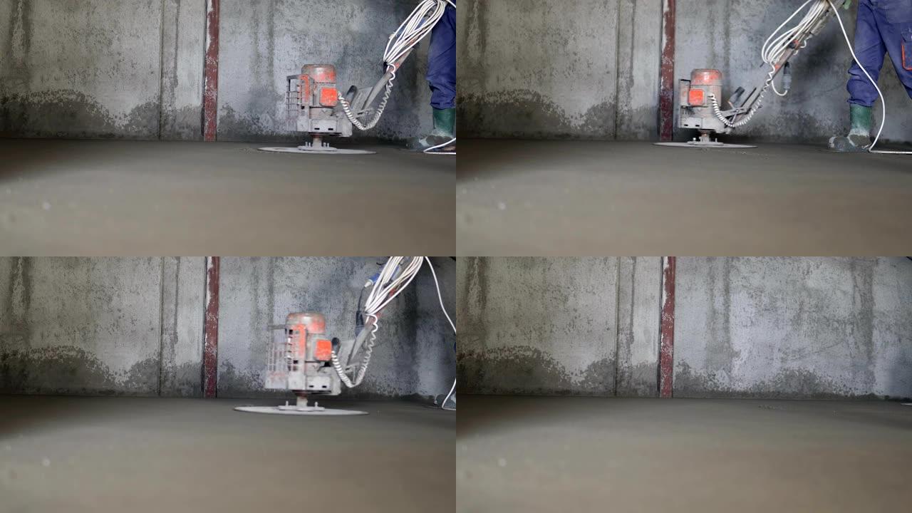 建筑工人生产水泥浆，并用特殊工具完成湿混凝土。浮动叶片。用于平滑和抛光混凝土、混凝土地板