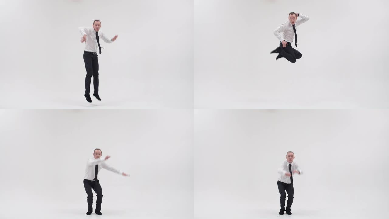 Breakdancer展示了霹雳舞的动作，跳开双腿，穿着白色背景的领带穿着办公室衣服。成年男性霹雳舞