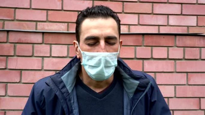 戴着医用口罩的人不能呼吸，窒息，窒息，生病，咳嗽沉重，呼吸困难，受苦。肖像