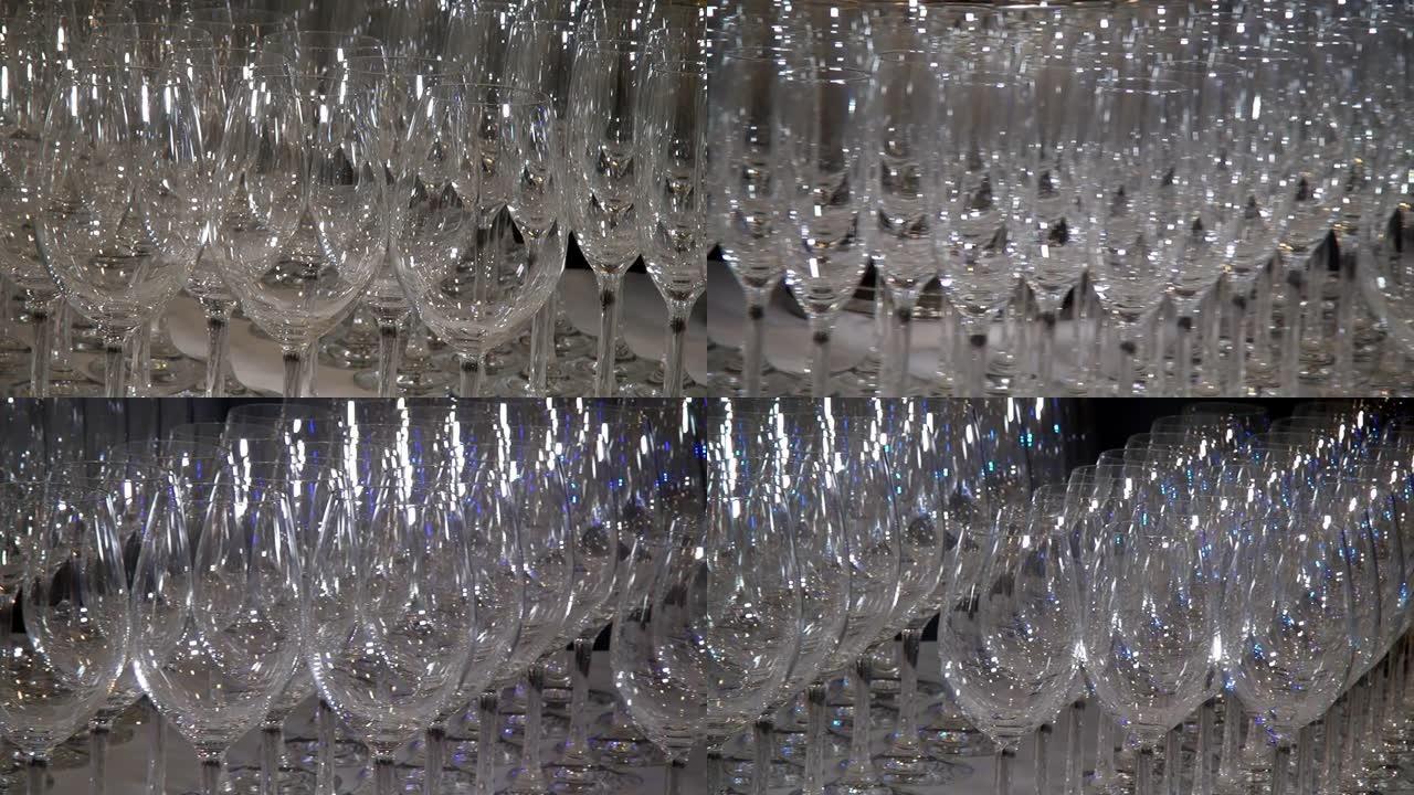 特写水晶透明玻璃高脚杯在宴会桌上闪耀。