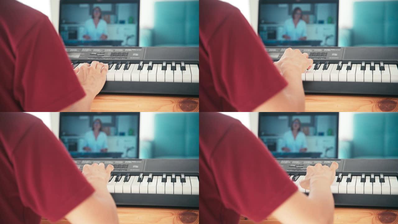 一个年轻的学生在网上看音乐课，在家学习。