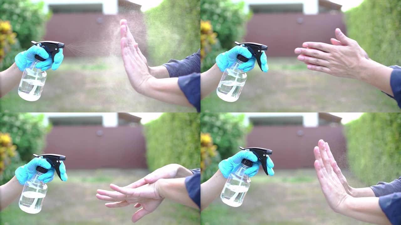 在人的手上喷洒杀菌剂溶液的4k镜头