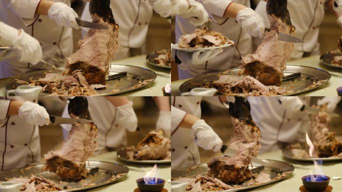 厨师用刀分享骨头上刚煮熟的大肉腿