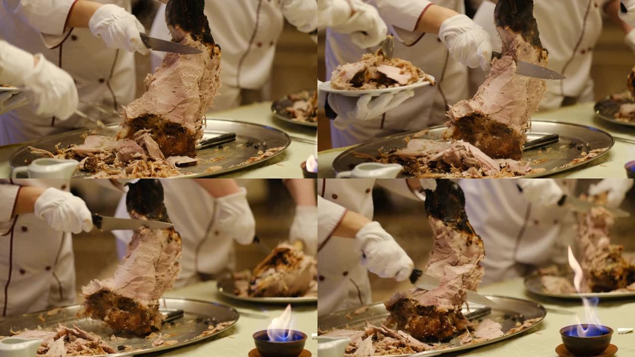 厨师用刀分享骨头上刚煮熟的大肉腿