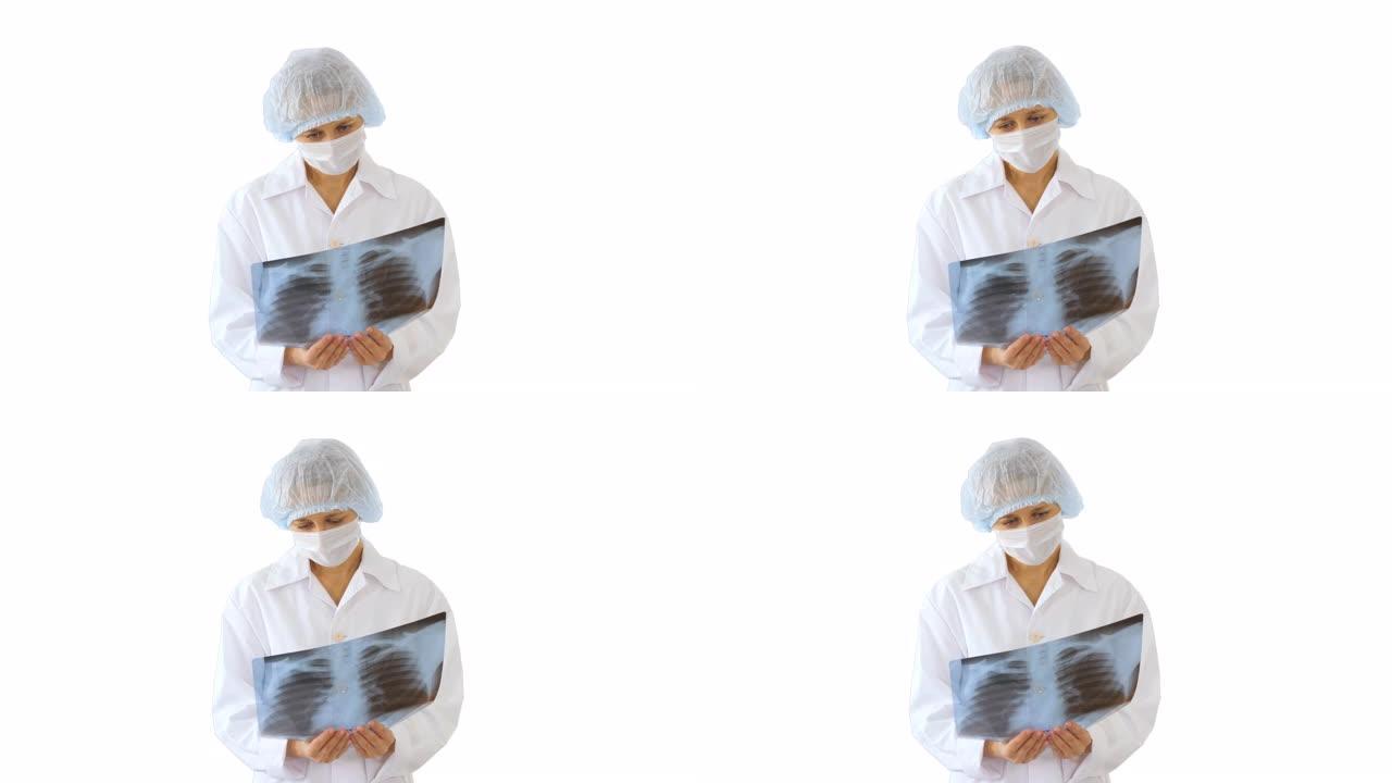 戴着医用口罩的女医生在白色背景上看x射线图像