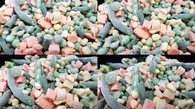 冷冻蔬菜。什锦蔬菜的俯视图。四季豆，豌豆，胡萝卜和玉米，特写