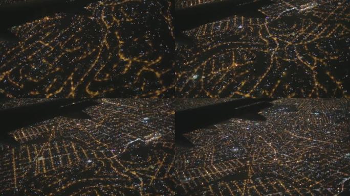 夜间航空从飞机侧翼城市灯光框的飞机窗户俯视里约热内卢巴西拉丁美洲的街道