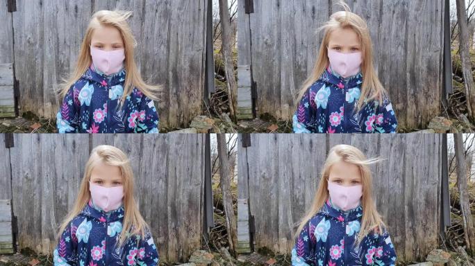 戴着医用呼吸面罩的小女孩