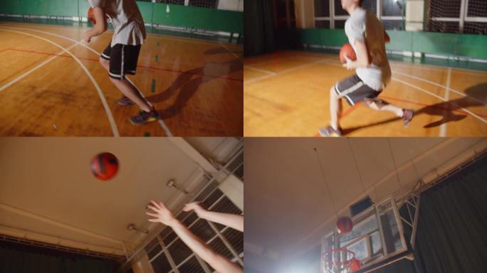 年轻的职业篮球运动员打球将球扔进篮筐夜晚黑暗剪影后视运球特写拼花耐力
