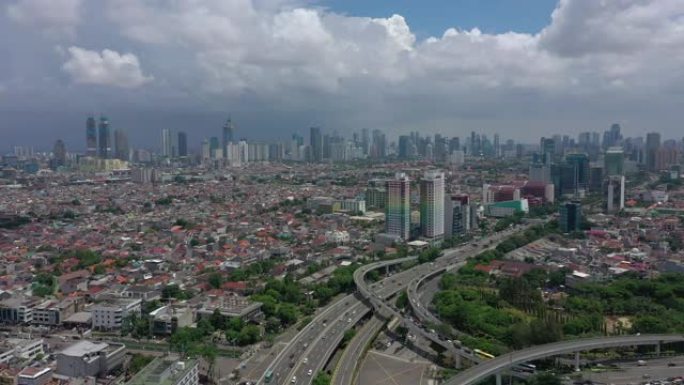 阳光灿烂的雅加达市市区繁忙的交通道路交汇处航空全景4k印度尼西亚