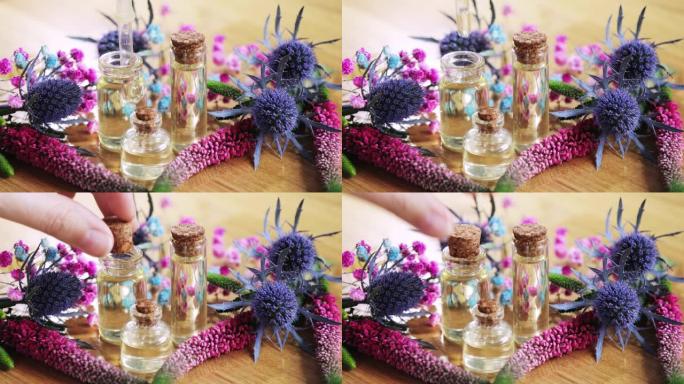 调香师创造新的芳香液体香水从小瓶中提取精油。