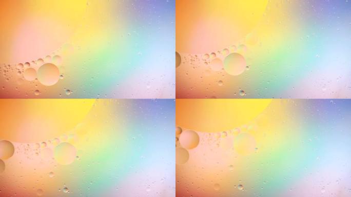 奇妙的彩色气泡结构。混沌运动。抽象彩色油漆。顶视图。液体中气泡的运动。油表面多色背景。宏