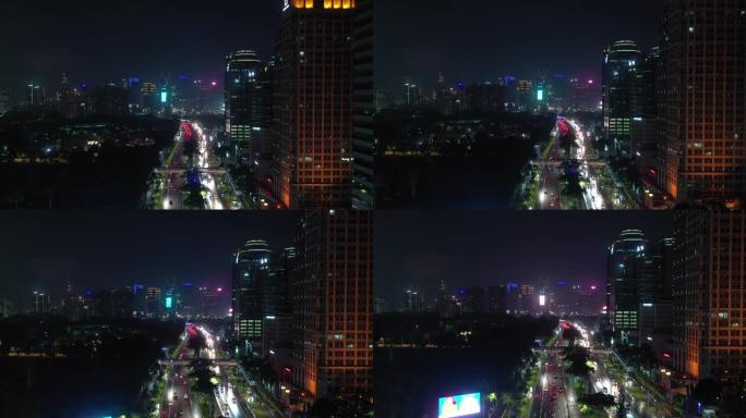 雅加达城市夜间照明市中心繁忙交通街大道航空全景4k印度尼西亚
