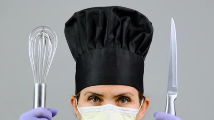 女厨师餐厅老板假扮戴着口罩、防护手套和厨房用具