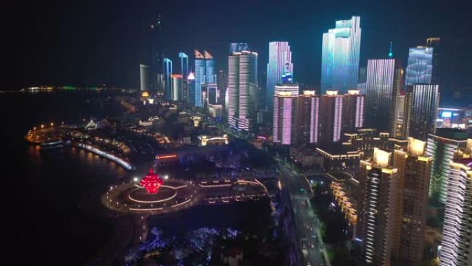 夜间照明秀青岛市著名市中心纪念碑交通湾空中全景4k中国