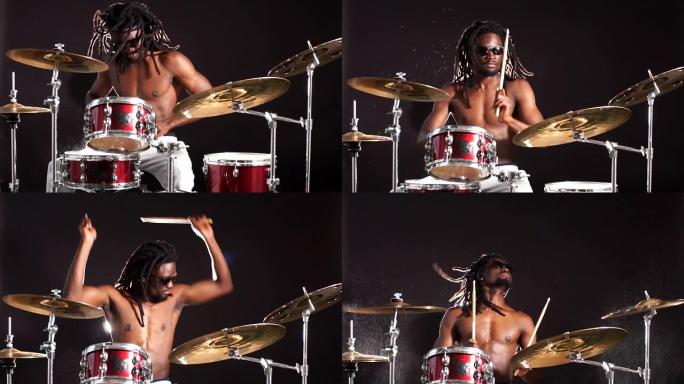 英俊的非洲鼓手在享受打湿鼓的同时产生水花