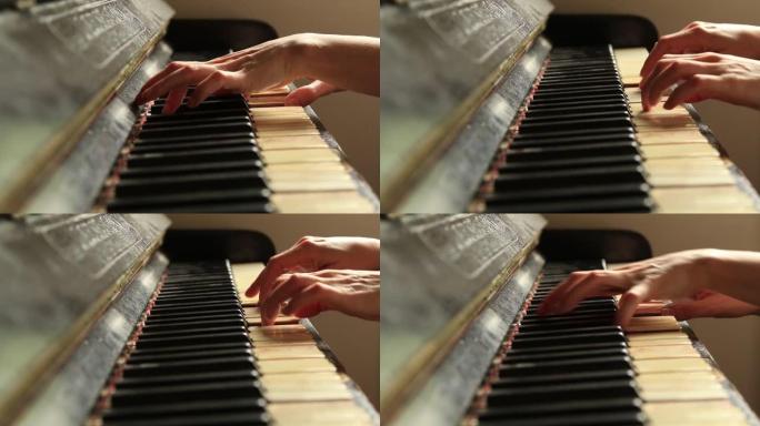 女钢琴家在生锈的钢琴琴键上，arms独奏音乐